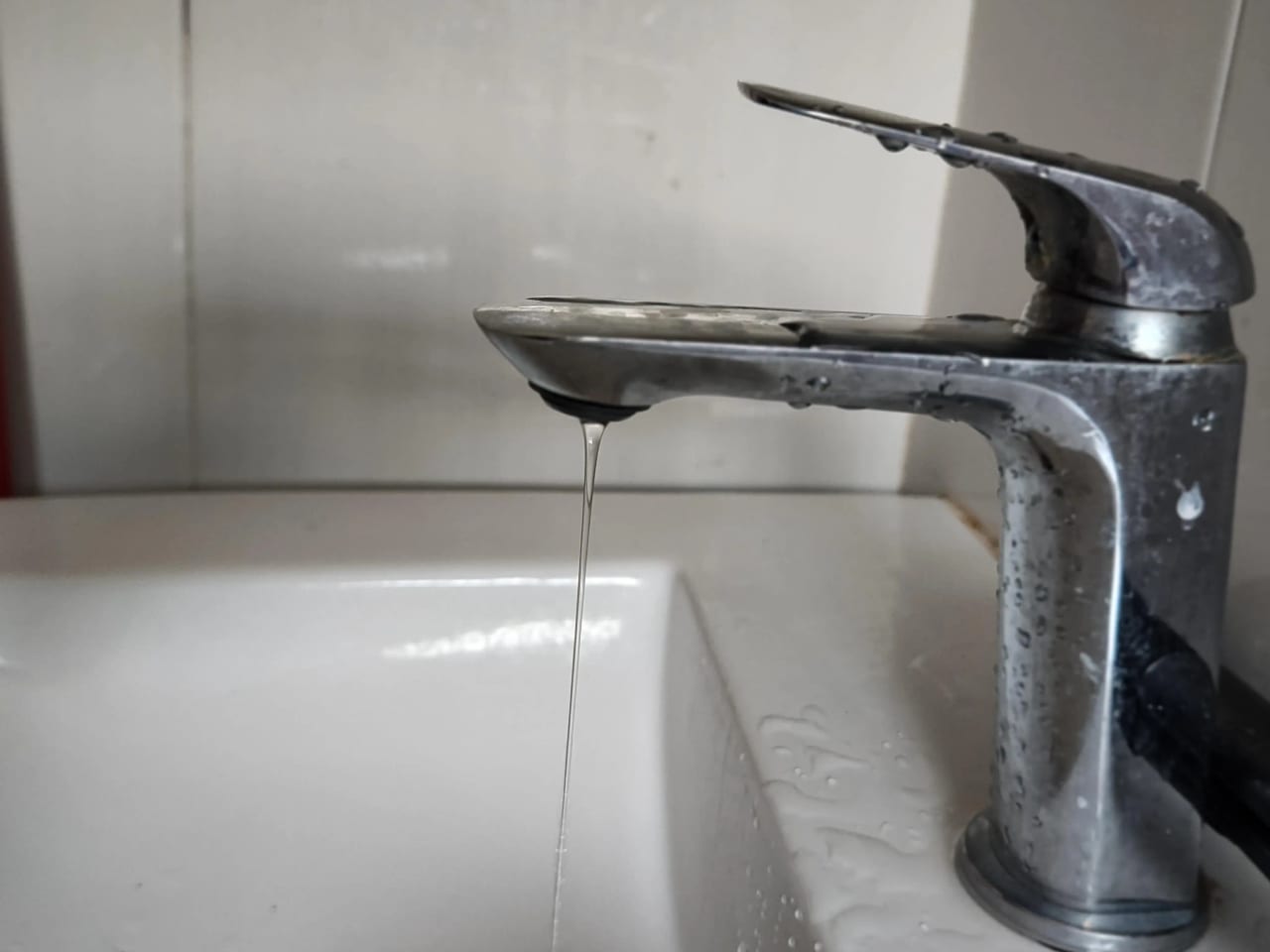 A faucet and basin during fixture maintenance
